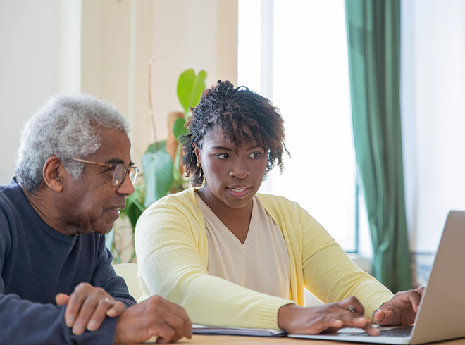 Older adult reviews care plan with nurse practitioner during Chronic Care Management session